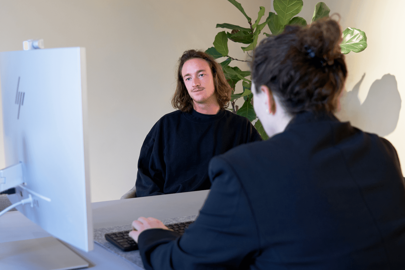 Person looking at a screen with doctor